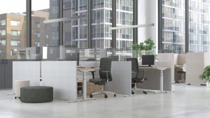 Office space with furnished cubicles and a view of high rises 
