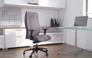 Picture of a sleek grey office chair in front of white cabinetry.