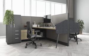 Picture of dark grey office cubicles in front of a window.